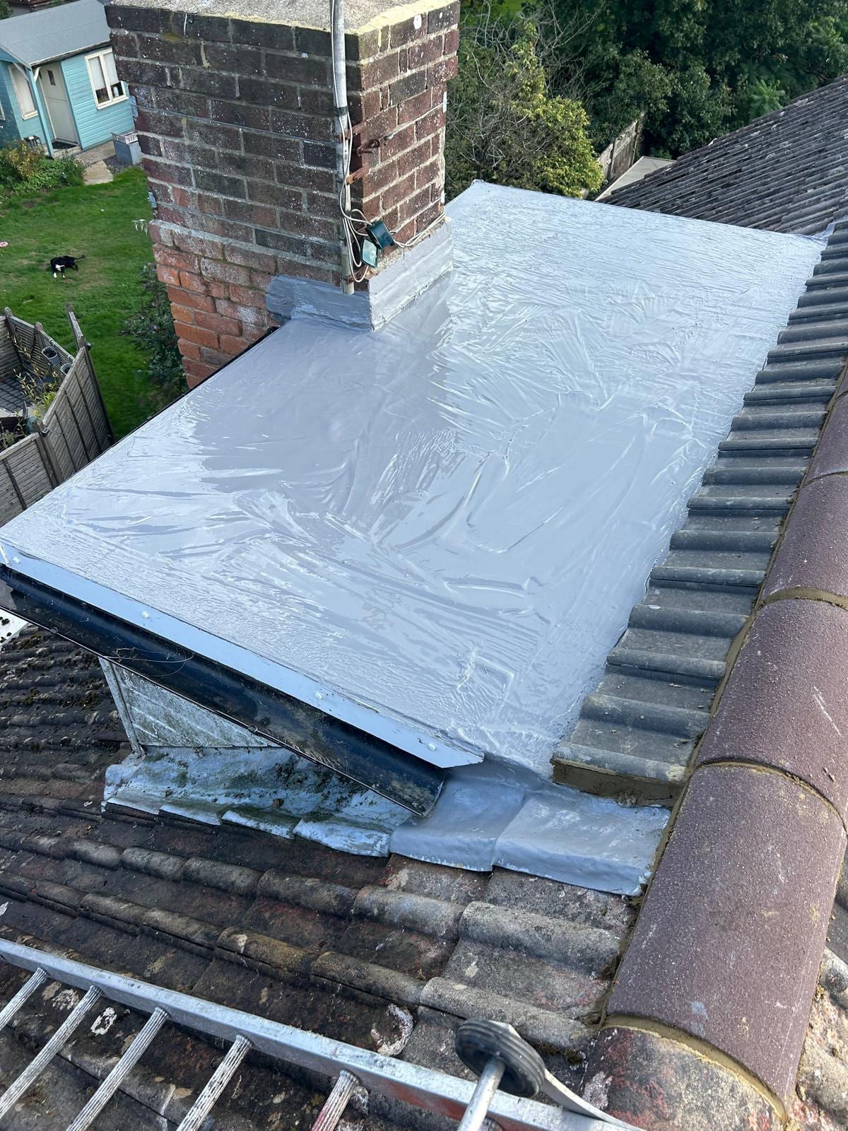 New GRP dormer roof finished neatly around the chimney
