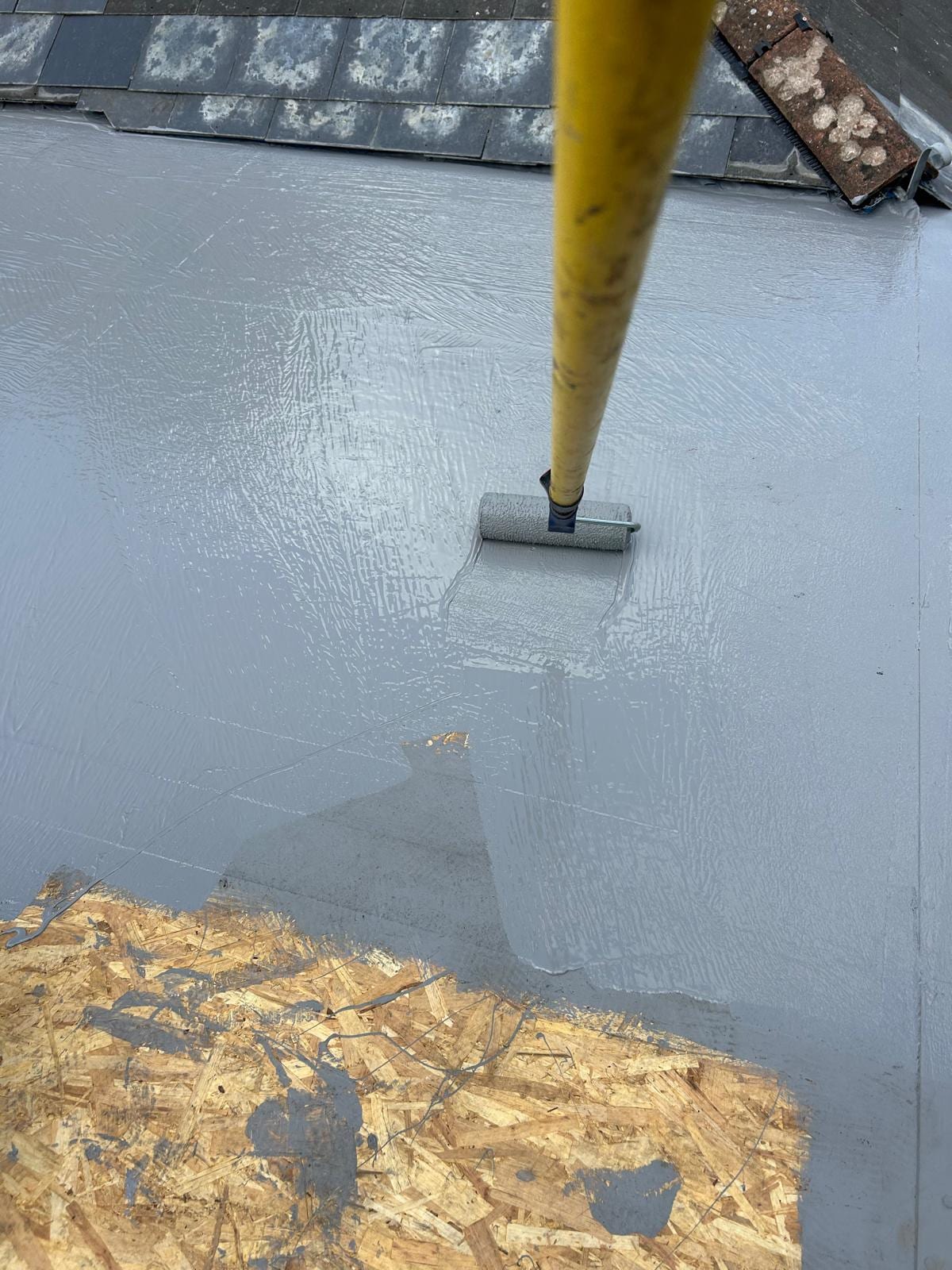 Shane's team laying a new flat roof in south-east London