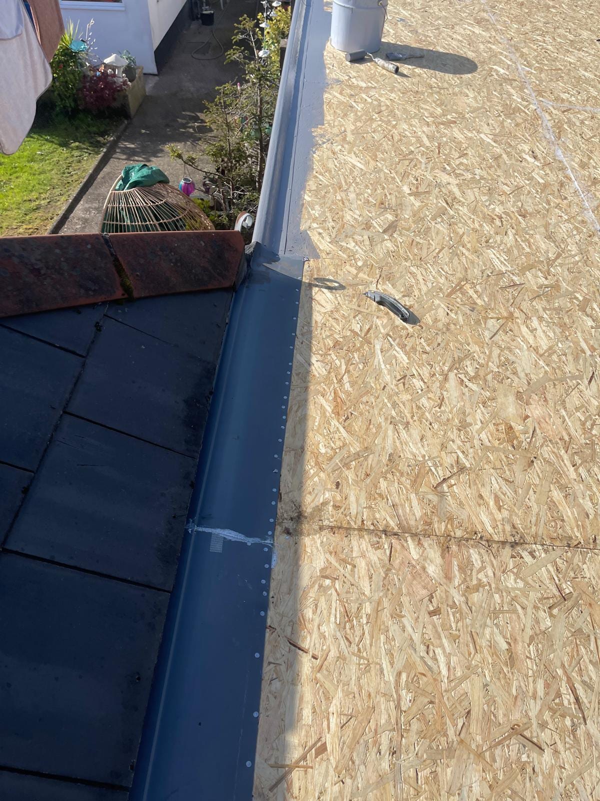 New UPVC trim and guttering on a flat roof edge