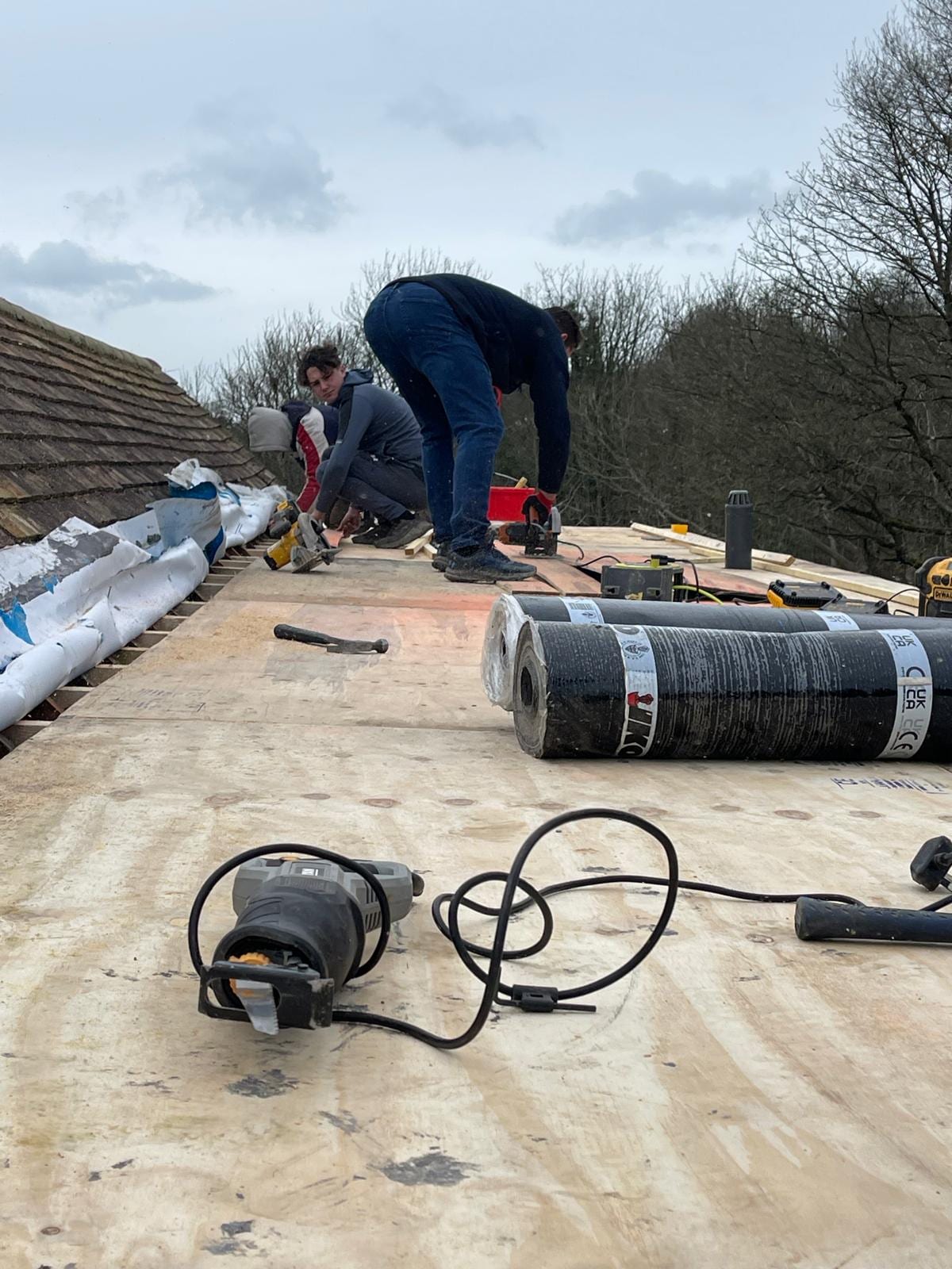 ASAP roofers laying a new felt flat roof